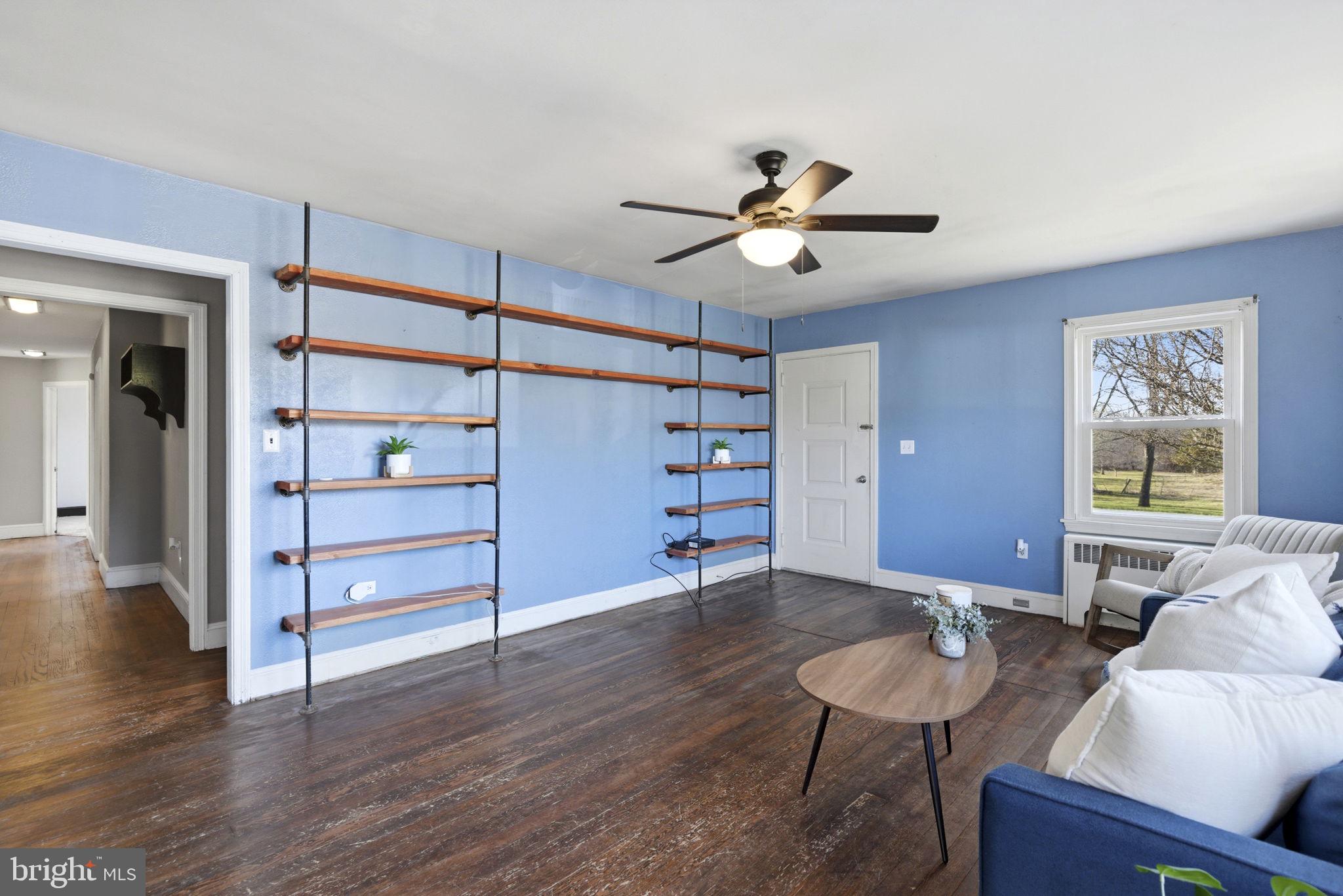 213 Groff Road Millington, MD 21651 - Photo 5 of 48 a view of a livingroom with furniture and wooden floor