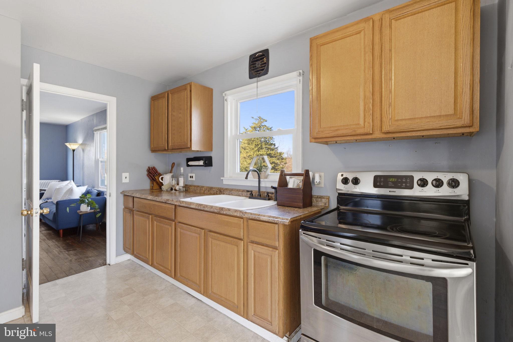 213 Groff Road Millington, MD 21651 - Photo 8 of 48 a kitchen with stainless steel appliances a stove a sink and cabinets