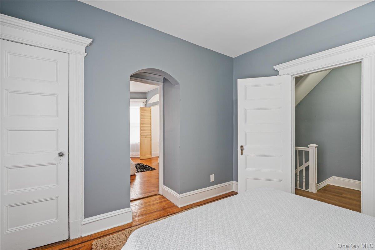 196-19 89th Road Queens, NY 11423 - Photo 12 of 28 wooden floor and windows in a room