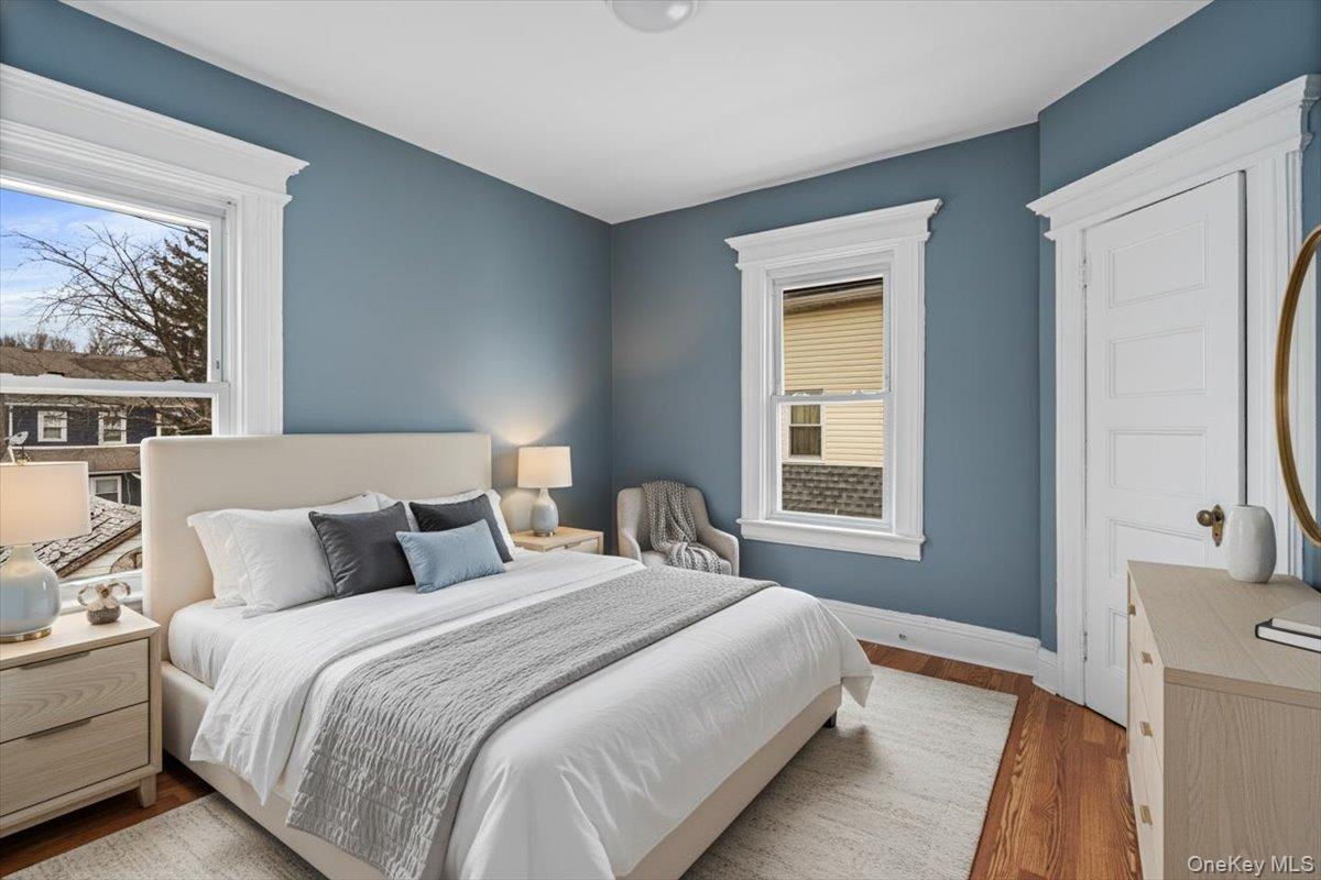 196-19 89th Road Queens, NY 11423 - Photo 15 of 28 a bedroom with bed and window