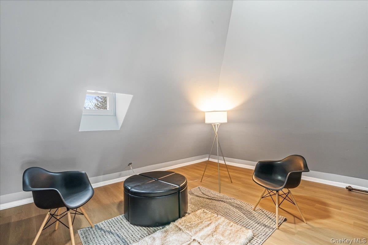 196-19 89th Road Queens, NY 11423 - Photo 19 of 28 a lamp and a table in a room