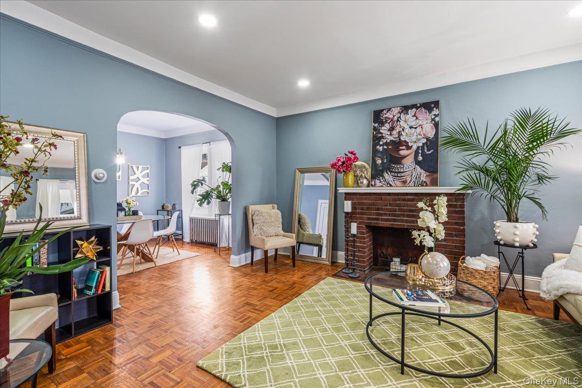 196-19 89th Road Queens, NY 11423 - Photo 4 of 28 a living room with furniture and a fireplace