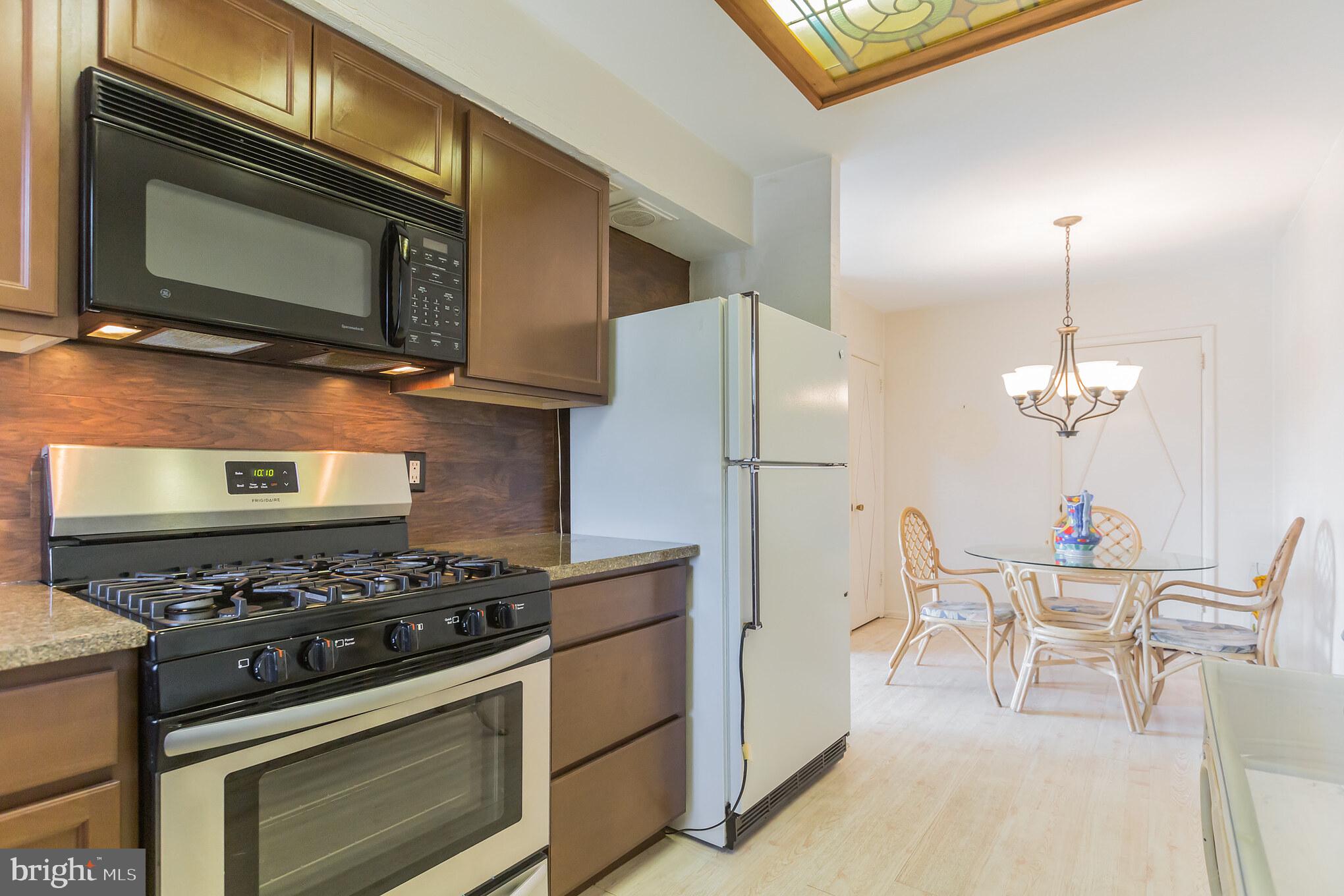 1160 Morefield Road Philadelphia, PA 19115 - Photo 10 of 31 Kitchen has new range, dishwasher, backsplash