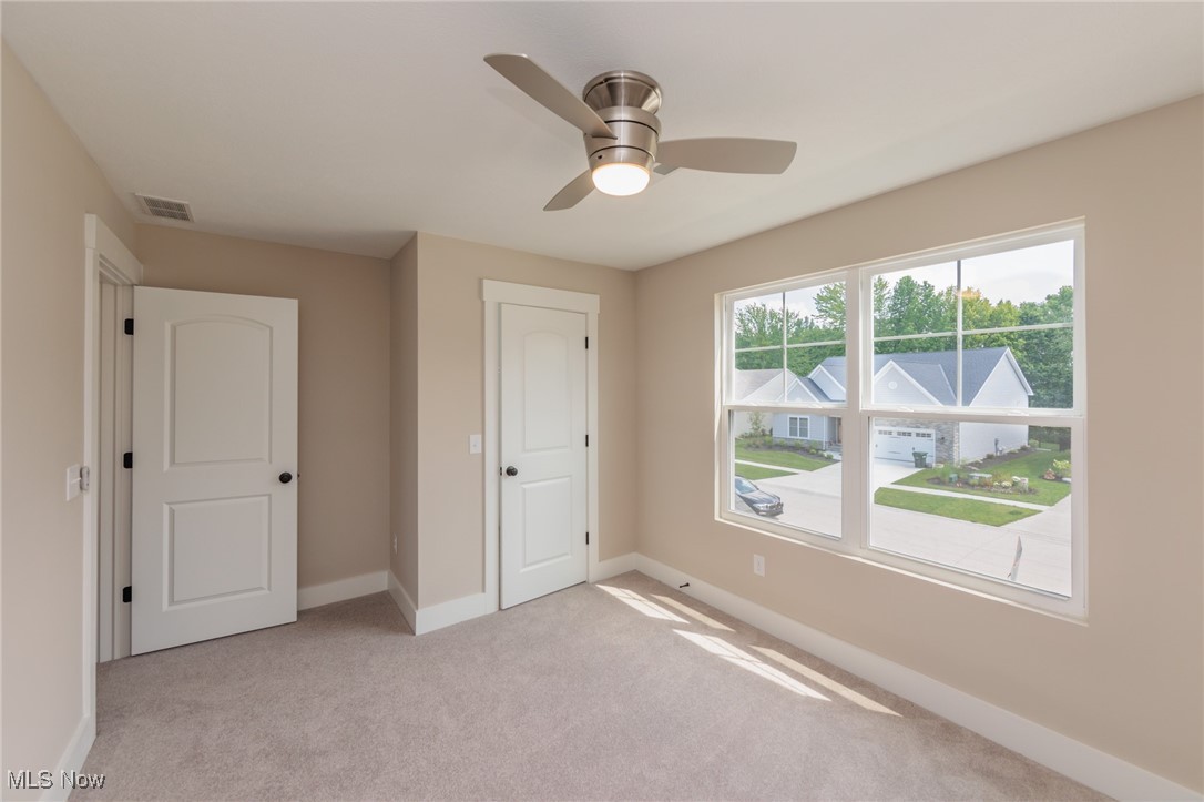 36458 Appian Way North Ridgeville, OH 44039 - Photo 22 of 37 Unfurnished bedroom with light colored carpet, ceiling fan, and a closet