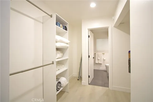 a bathroom with a glass shower door and a sink