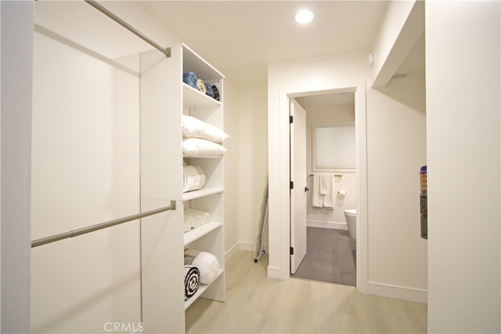 1140 Pacific Avenue, Unit 7 Long Beach, CA 90813 - Photo 14 of 21 a bathroom with a glass shower door and a sink