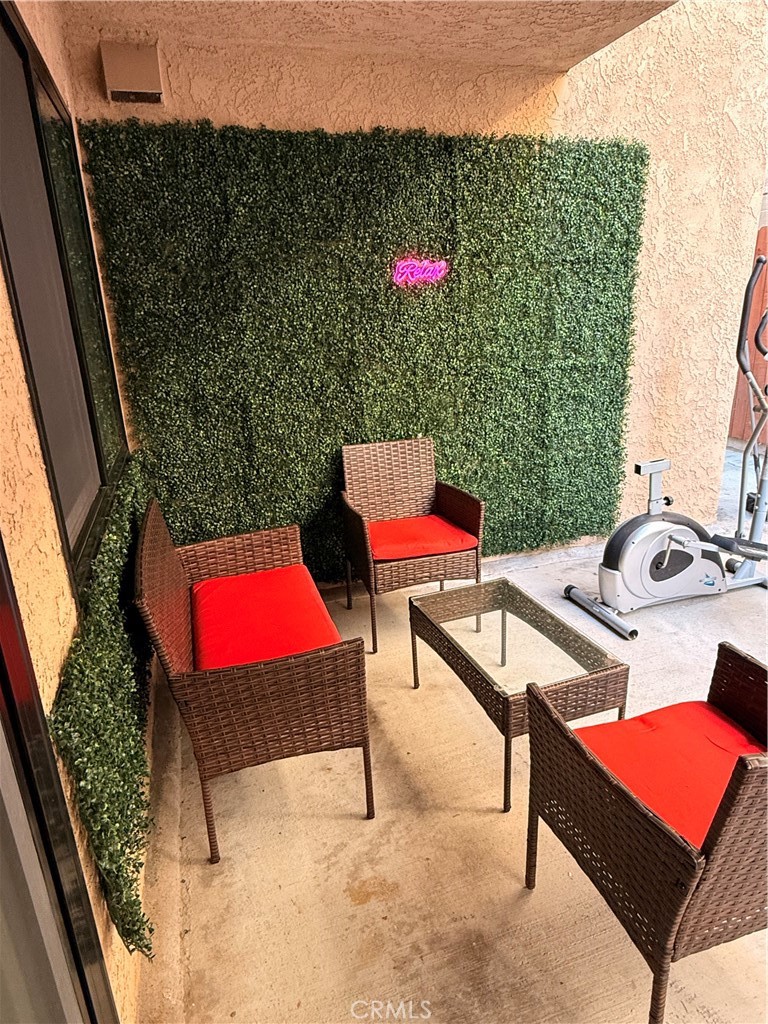 1140 Pacific Avenue, Unit 7 Long Beach, CA 90813 - Photo 18 of 21 a view of a outdoor space with seating area