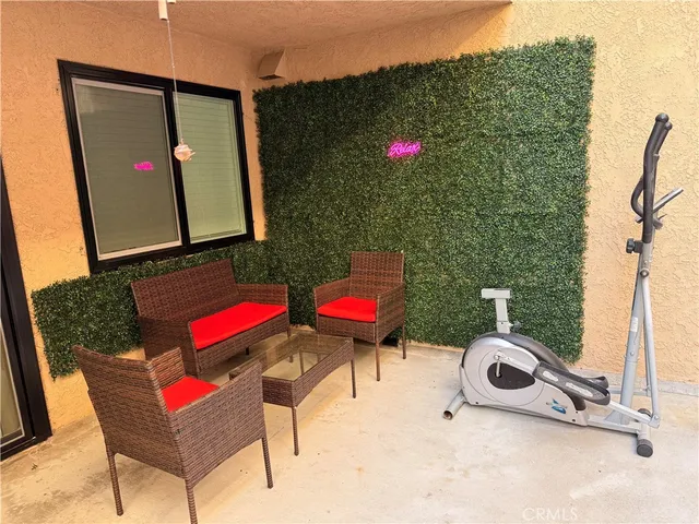 a view of a chairs and table in the terrace