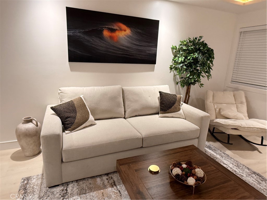 1140 Pacific Avenue, Unit 7 Long Beach, CA 90813 - Photo 4 of 21 a living room with furniture and a flat screen tv