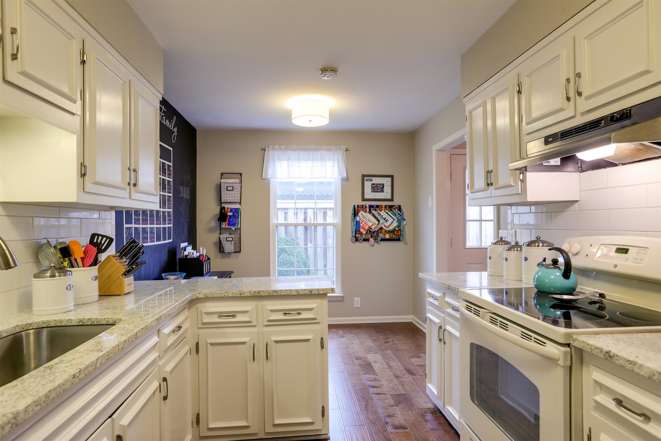 816 General George Patton Road Nashville, TN 37221 - Photo 11 of 18 White Kitchen! Beautiful granite, extra deep sink, lots of storage.