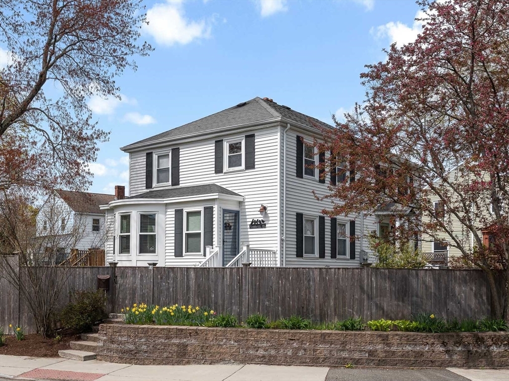 75 Fremont Street Arlington, MA 02474 - Photo 1 of 20 a front view of a house with a yard