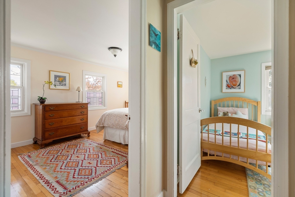75 Fremont Street Arlington, MA 02474 - Photo 13 of 20 a bedroom with a bed and balcony view