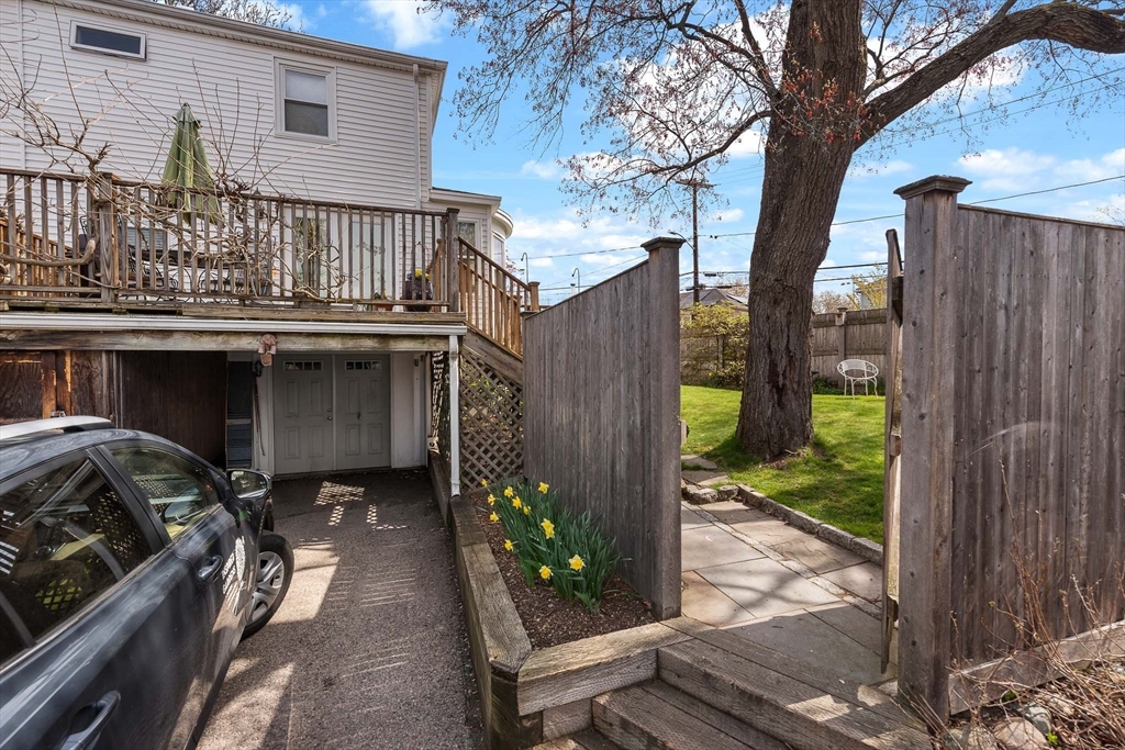 75 Fremont Street Arlington, MA 02474 - Photo 17 of 20 a balcony with wooden floor table and chairs