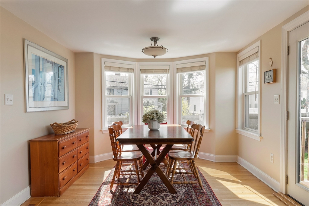 75 Fremont Street Arlington, MA 02474 - Photo 6 of 20 a dining room with furniture a chandelier and wooden floor