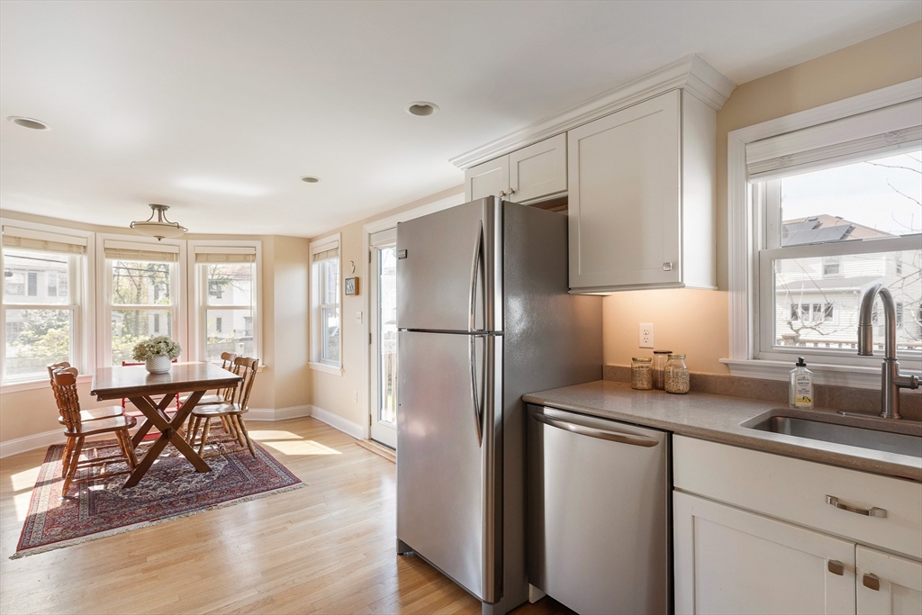 75 Fremont Street Arlington, MA 02474 - Photo 8 of 20 a kitchen with stainless steel appliances granite countertop a refrigerator and a sink
