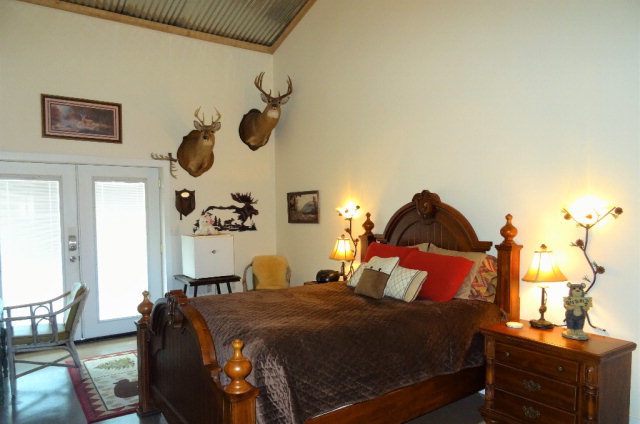 429 Hudson Jones Road Cochran, GA 31014 - Photo 14 of 45 a bedroom with a bed and wooden floor
