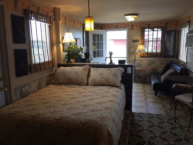 429 Hudson Jones Road Cochran, GA 31014 - Photo 35 of 45 a spacious bedroom with a bed a couch and dresser