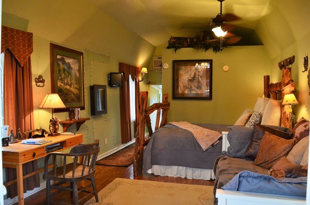 429 Hudson Jones Road Cochran, GA 31014 - Photo 37 of 45 a living room with furniture a chandelier and a dining table