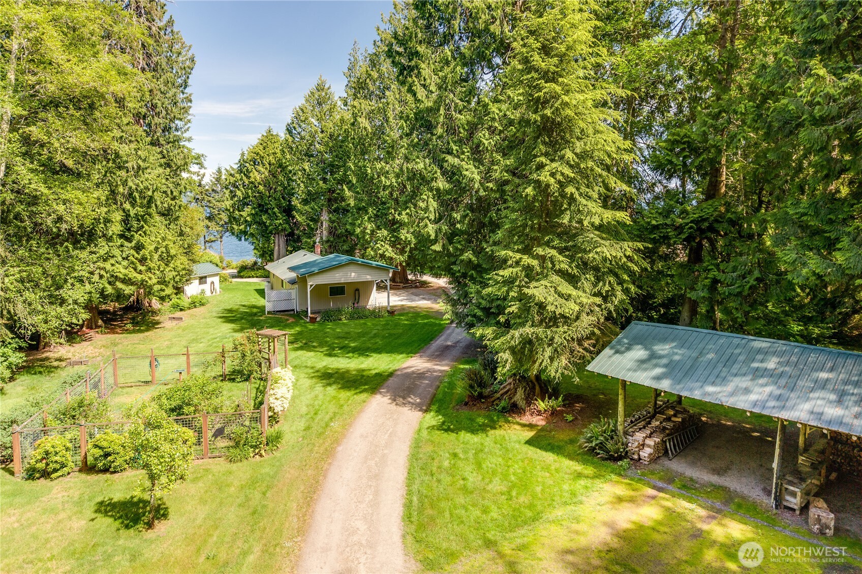252 Jansen Road Nordland, WA 98358 - Photo 25 of 40 a small pool with trees in the background