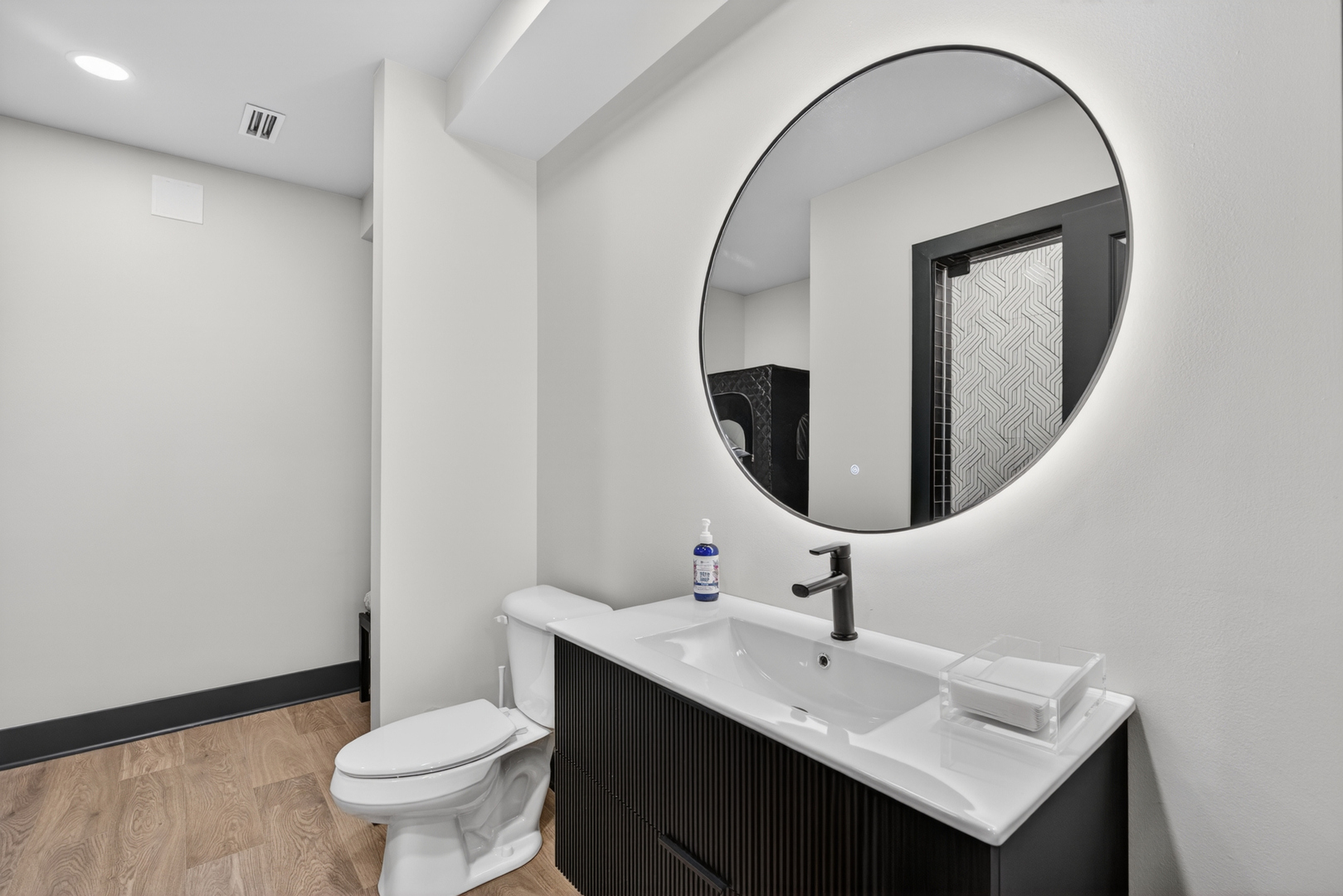 16230 Lake View Road Plainfield, IL 60586 - Photo 47 of 62 a bathroom with a sink and a mirror
