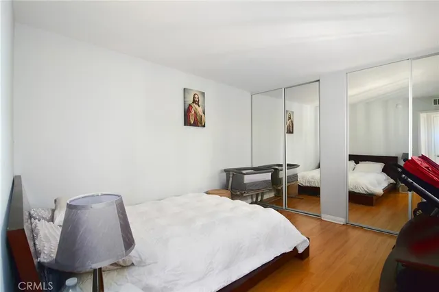 a bedroom with a bed and a chair