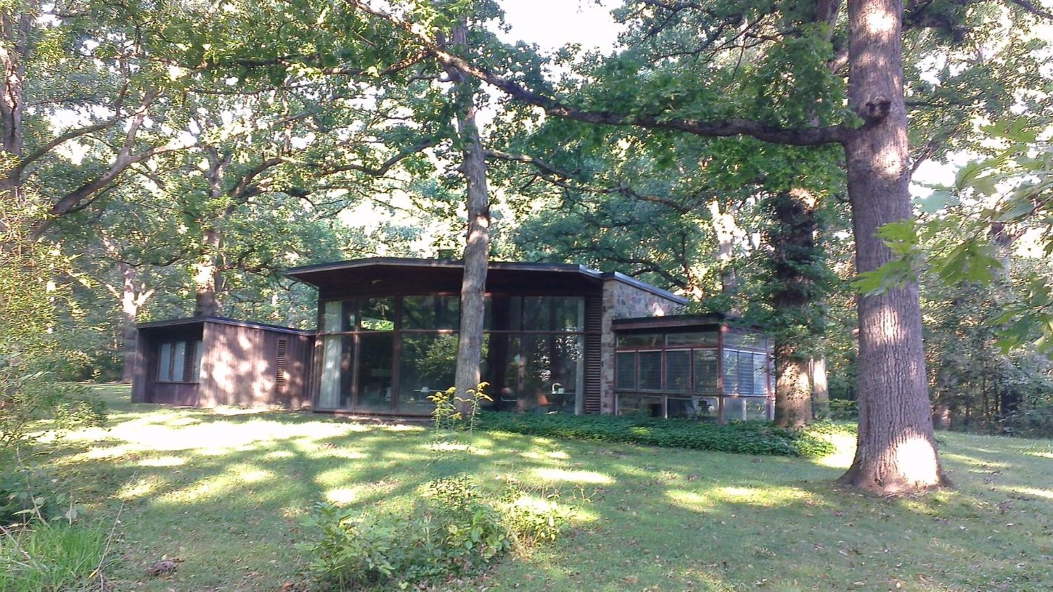 a view of a house with a yard tree s