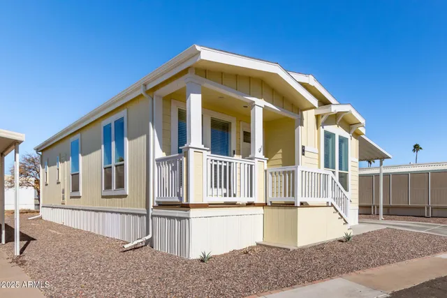 a front view of a house with large windows