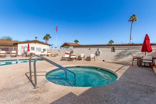a view of a swimming pool with a lounge chairs