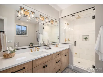 a bed room with a bed and a chandelier