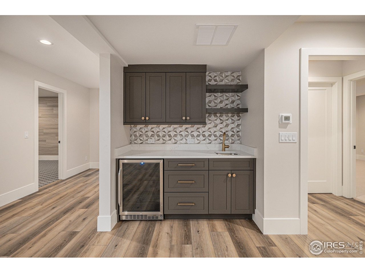 760 Jersey Street Denver, CO 80220 - Photo 28 of 41 Basement built in wet bar with beverage fridge