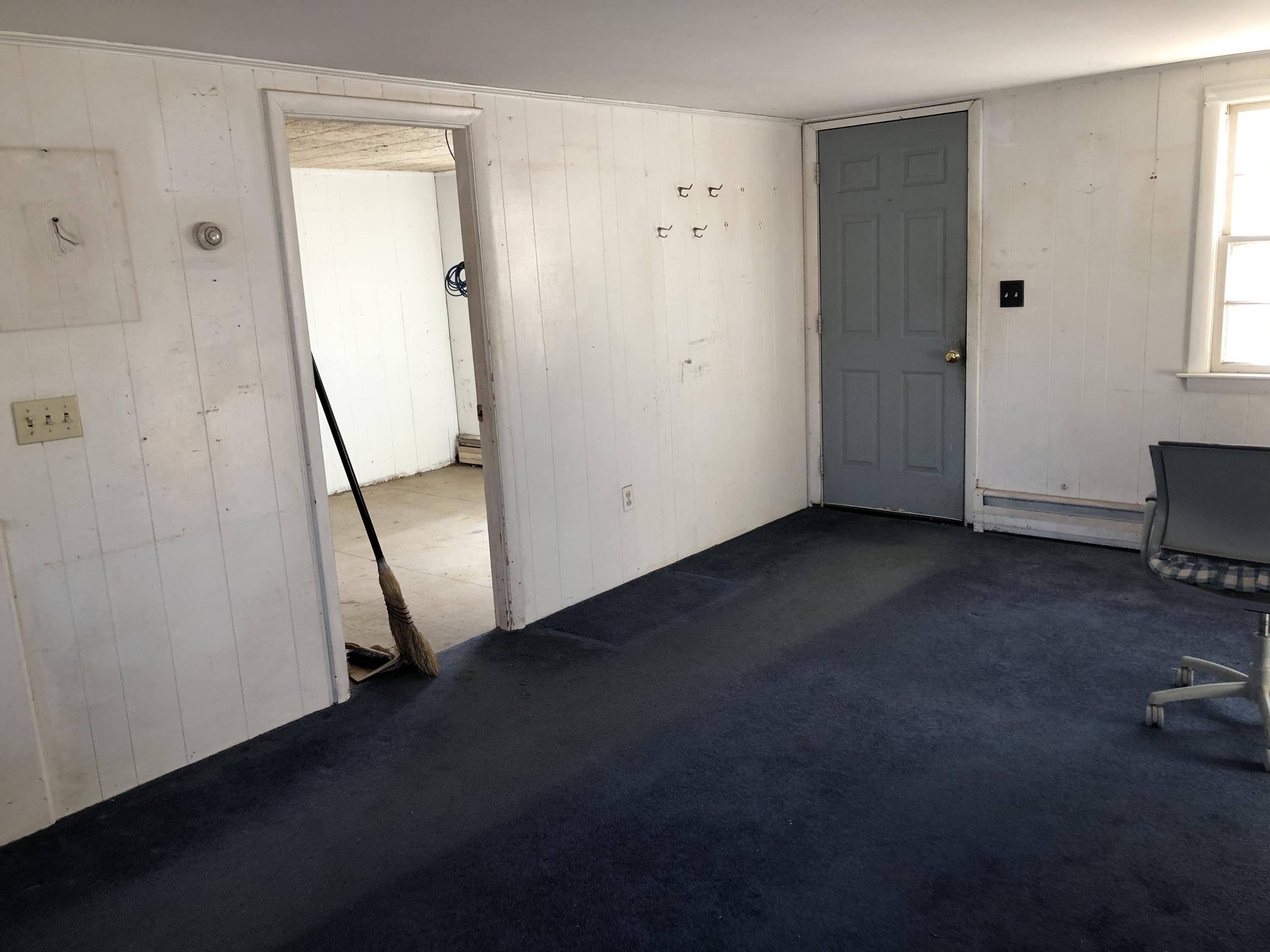 9 Childs Homestead Road Orleans, MA 02653 - Photo 17 of 19 an empty room with a door