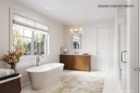 a spacious bathroom with a tub sink and mirror
