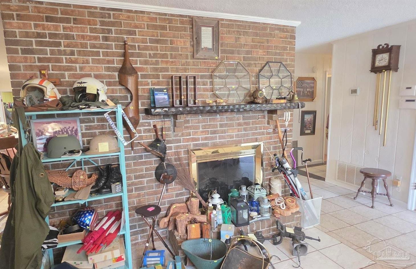 8246 Chellie Road Pensacola, FL 32526 - Photo 12 of 20 Full of Estate Sale items living room/fireplace