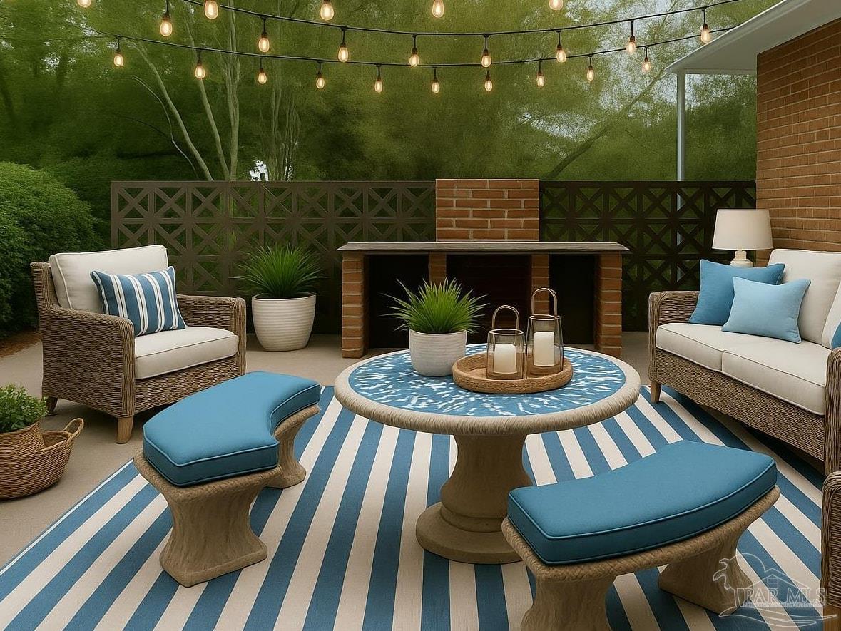 8246 Chellie Road Pensacola, FL 32526 - Photo 17 of 20 a view of a patio with a dining table and chairs