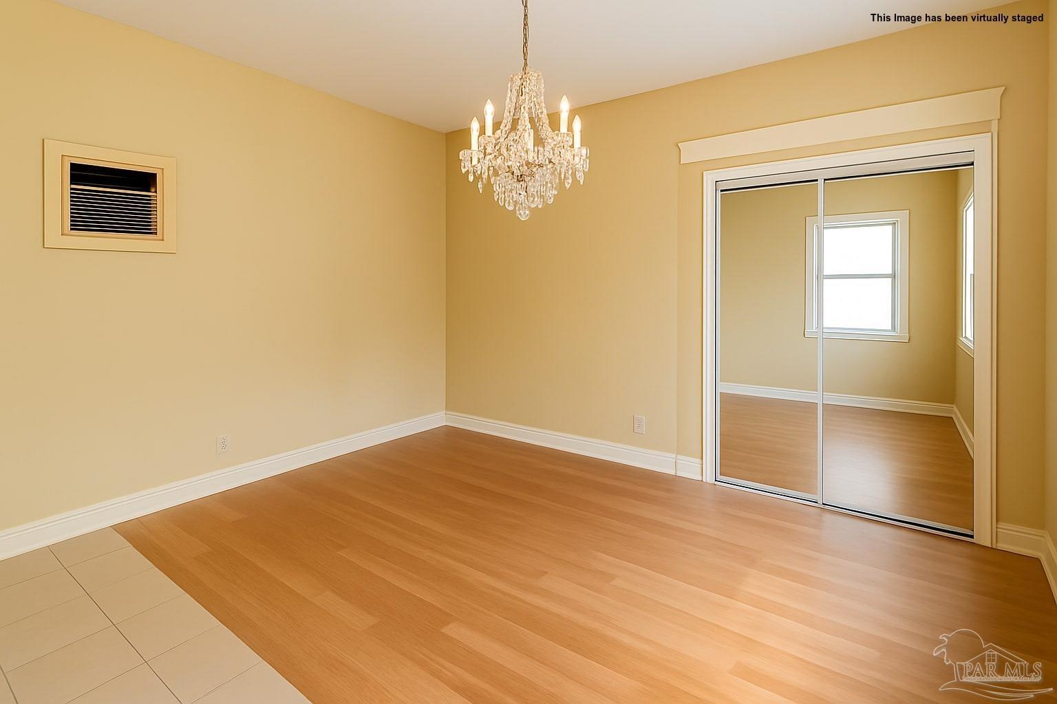 8246 Chellie Road Pensacola, FL 32526 - Photo 19 of 20 a view of empty room with window and wooden floor