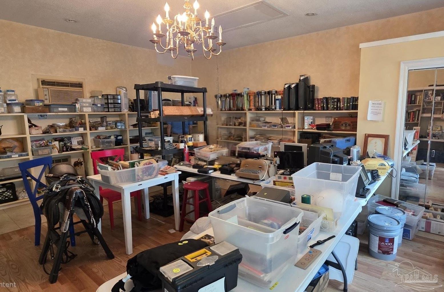 8246 Chellie Road Pensacola, FL 32526 - Photo 20 of 20 a view of a dining room with furniture a rug and a chandelier