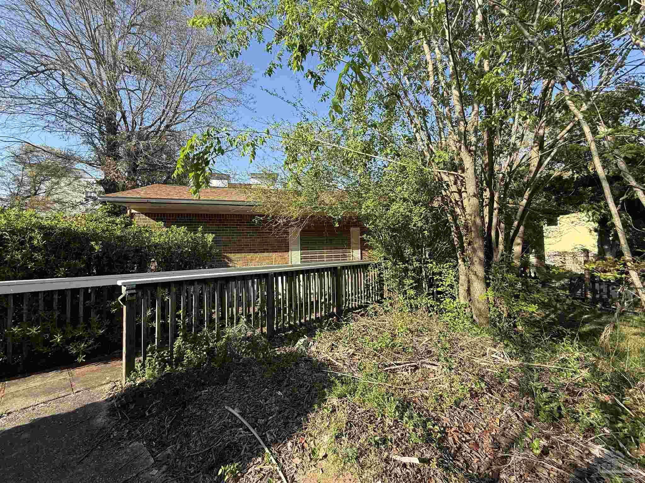 8246 Chellie Road Pensacola, FL 32526 - Photo 5 of 20 a view of a deck with a bench
