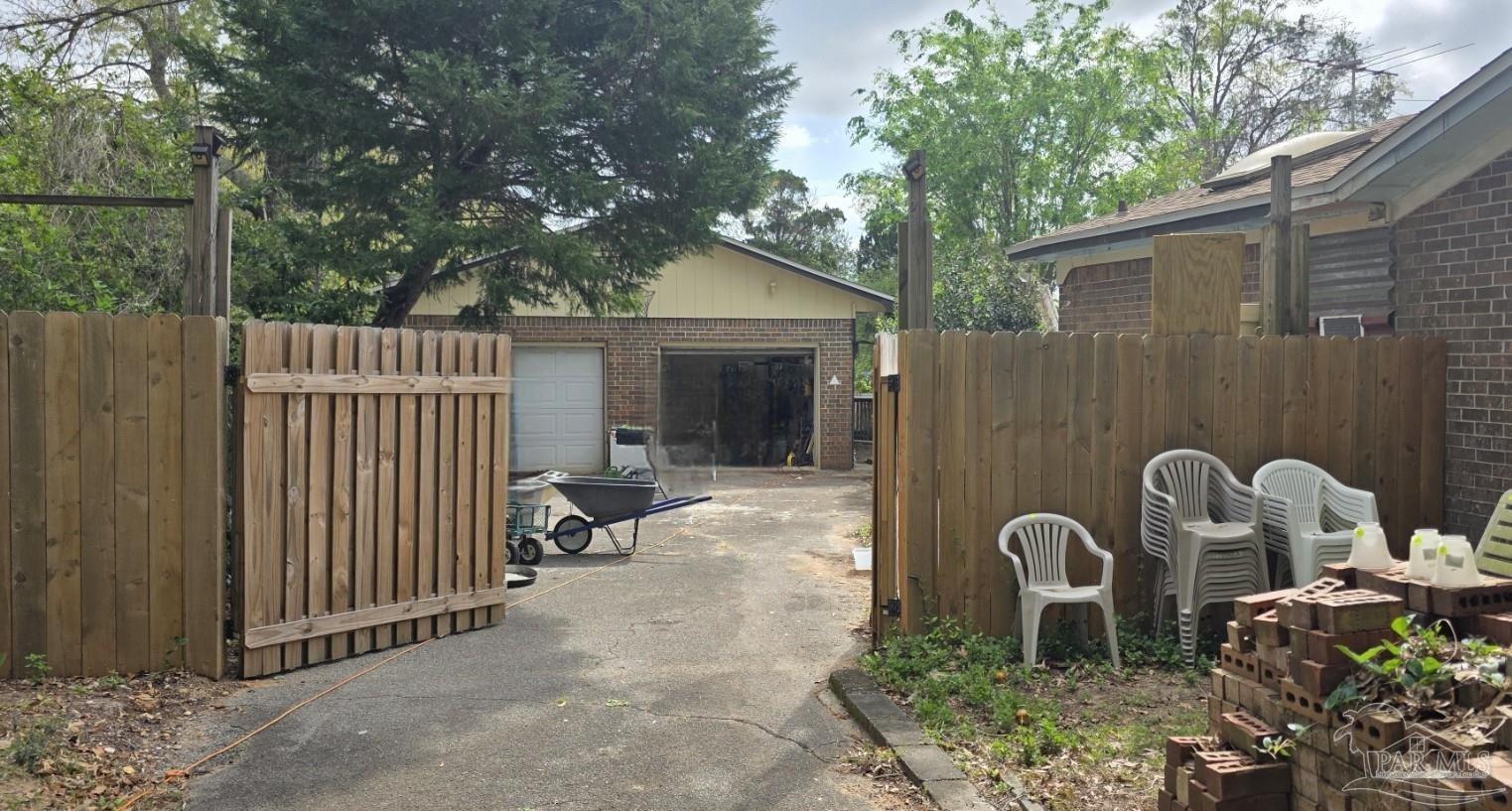8246 Chellie Road Pensacola, FL 32526 - Photo 6 of 20 a view of backyard with outdoor seating and trees