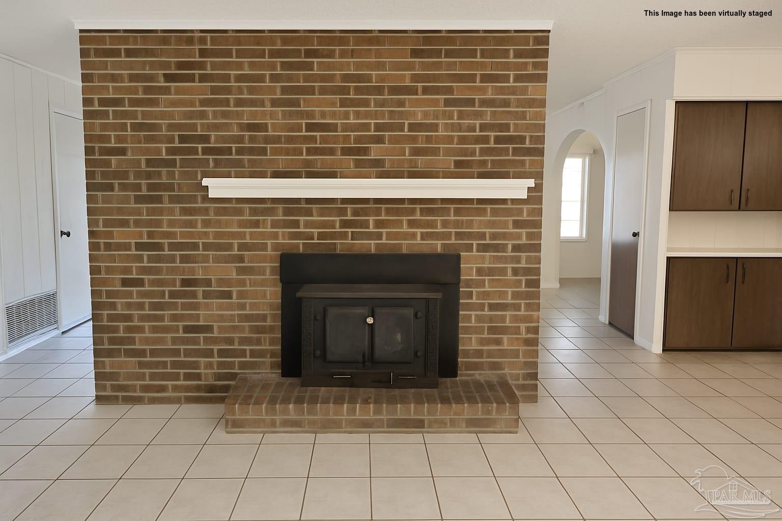 8246 Chellie Road Pensacola, FL 32526 - Photo 9 of 20 a view of empty room with fireplace and wooden floor