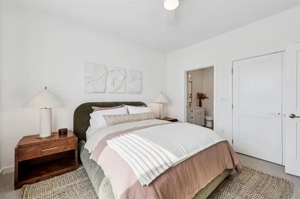 a bedroom with a bed and a couch