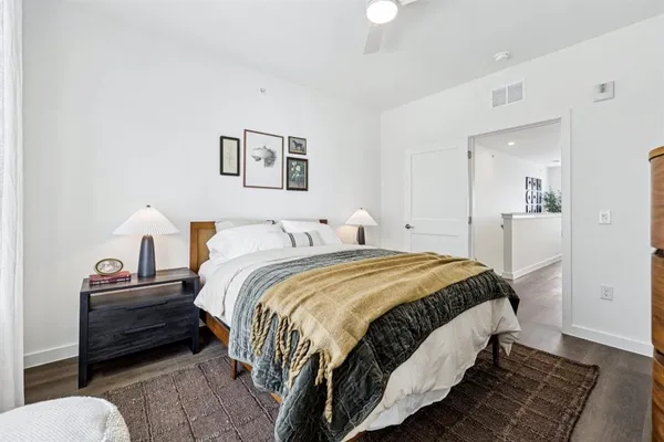 a bed room with a bed and a lamp