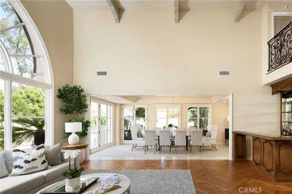 a living room with fireplace furniture and a large window