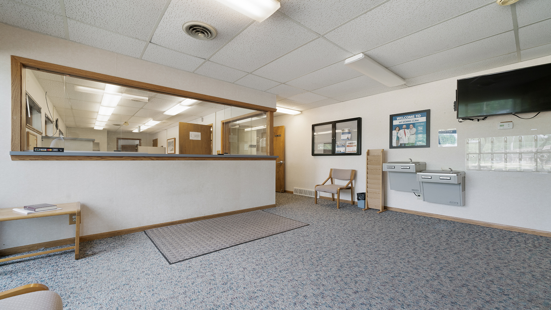 405 Charles Street Mount Morris, IL 61054 - Photo 11 of 61 a living room with furniture and a flat screen tv