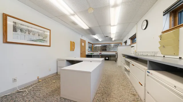a kitchen with cabinets and window