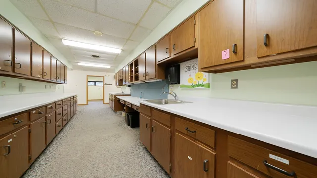 a kitchen with stainless steel appliances granite countertop a sink and cabinets