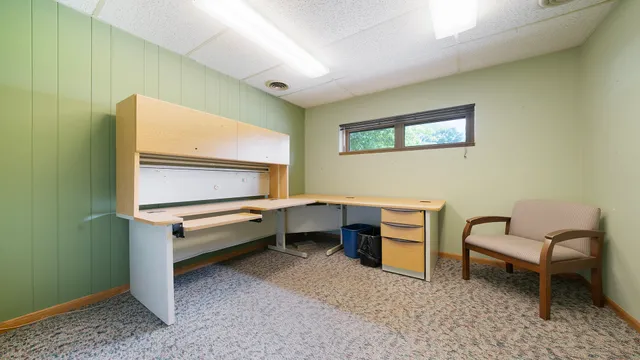 a room with furniture and white walls