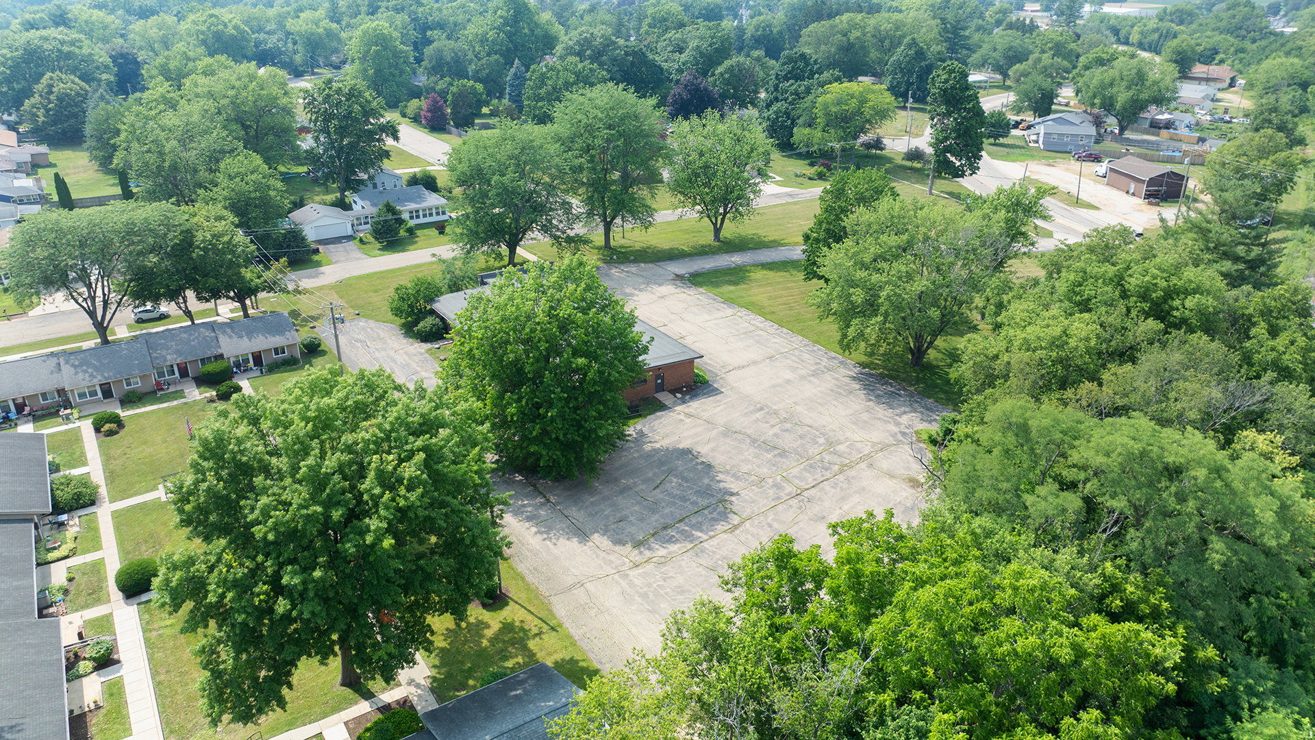 405 Charles Street Mount Morris, IL 61054 - Photo 3 of 61 a view of a yard with plants and large trees
