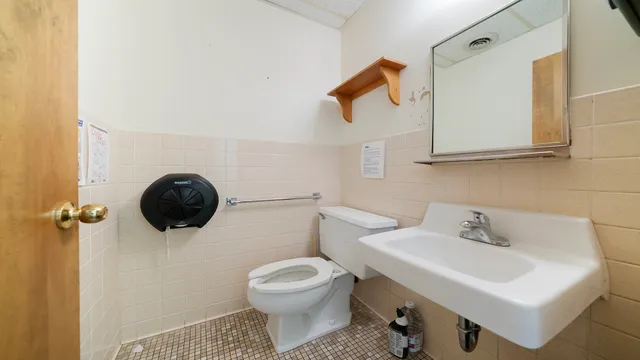 a view of a hallway with stairs