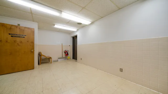 a kitchen with a sink cabinets and appliances