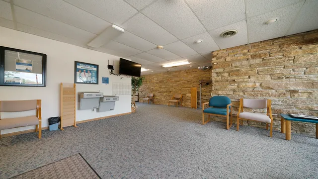 a view of livingroom with furniture and workspace